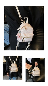 Detail of white tweed mini backpack with pink charm and gold hardware accents