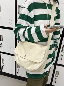 Minimalist beige canvas crossbody tote bag with flap and metal snap for daily commute