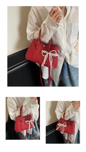 Detail of red garden bag with white lace pearl bow and lychee texture finish