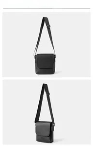 Close-up of black lychee texture flap bag featuring silver metal buckle and engraved logo