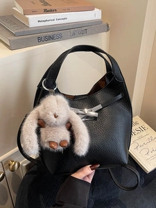 Retro black litchi texture bucket bag with silver lock and plush rabbit pendant charm