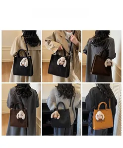 Detail shots showing tote bag capacity, detachable rabbit charm, and crossbody styling options