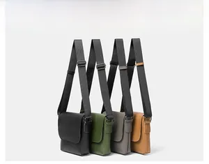 Selection of faux leather crossbody bags in black, green, grey, and brown with adjustable straps