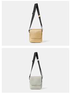 Close-up of pebble leather texture and metal buckle on crossbody bags in beige and grey