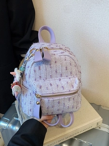 Lavender tweed mini backpack with gold zippers and a cute plush doll charm
