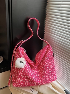 Pink animal print canvas tote bag with shoulder strap and fluffy eye charm pendant