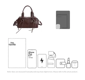 Deep brown Boston bag capacity detail showing storage for tablets and essentials