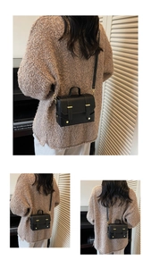 Detailed views of a black mini messenger bag featuring gold buckle and adjustable strap