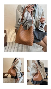 Detail of brown hand-woven texture and cylindrical strap on a large hobo bucket bag