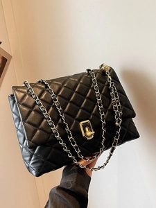 Classic black quilted shoulder bag with gold chain strap and large diamond pattern