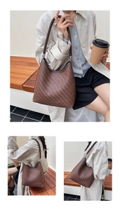 Detailed view of dark brown woven texture and silver hardware on hobo bucket bag