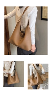 Detailansicht der genarbten Lederstruktur und Schnalle einer großen braunen Shopper-Tasche