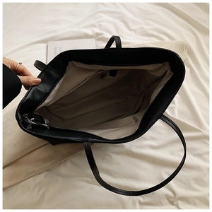 Detail view of large tote bag interior with zipper pocket and light fabric lining