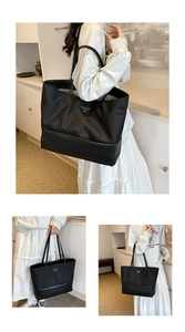 Close-up of black nylon tote bag featuring a silver triangle metal logo and premium PU trim