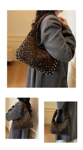 Close-up of leopard print hobo bag featuring silver rivet studs and retro hobo silhouette