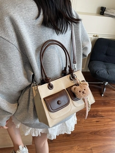 Winter vintage contrast tote bag with pockets and cute bear charm shown on model