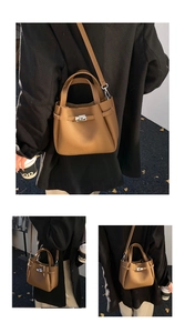 Detailed views of a brown pebbled bucket bag with silver twist lock and crossbody strap