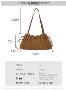 Detail view of the brown pleated tote bag showing its texture, dimensions, and shoulder strap