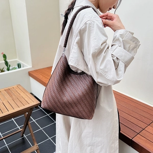 Brown woven leather hobo bag for women with thick shoulder strap for daily commuting