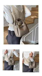 Detail of elephant grey lychee pattern bucket bag showing hand carry and crossbody styles