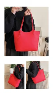 Detailed views of red lychee grain leather tote bag with metal adjustment buckle