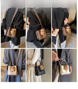 Detailed views of vintage bucket bag with plush bear charm and adjustable shoulder straps
