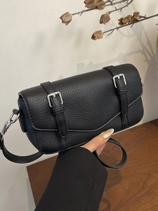 Classic black pebbled leather satchel bag with silver buckle straps and adjustable strap