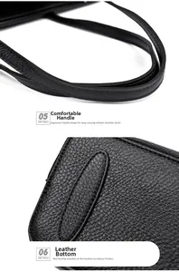 Close-up of dual handles and reinforced base on a black pebble leather tote bag