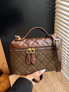 Brown and olive green quilted square handbag with gold hardware and long shoulder strap