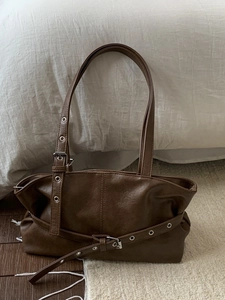 Retro coffee brown faux leather tote bag with metal eyelet strap detail and square buckle