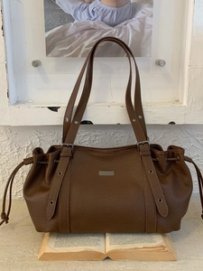 Vintage dark brown pebble leather tote bag with drawstring sides and adjustable strap