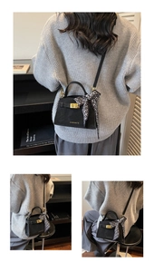 Detail of black matte handbag with gold lock and decorative silk scarf on handle