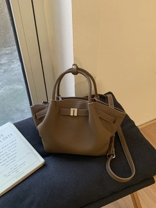 Dark brown lychee pattern leather tote bag with elegant metal buckle and long strap