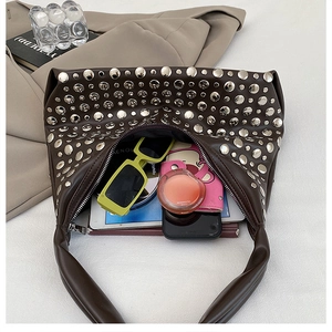 Interior view of the dark brown rivet shoulder bag showing large capacity for essentials