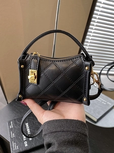 Classic black quilted handbag with gold twist lock and crossbody strap for daily casual style
