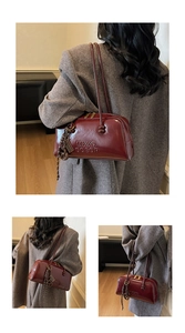 Detail of burgundy glossy leather pillow bag with MKXQ COEOR embossing and woven charm