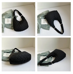Vues détaillées d'un sac cabas matelassé noir avec anneaux argentés et tissu en nylon