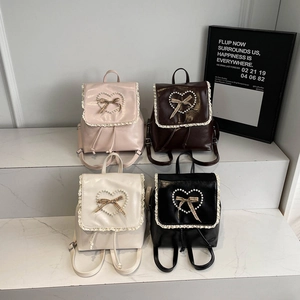 Lace-trimmed PU leather backpacks in four colors featuring pearl heart and bow details
