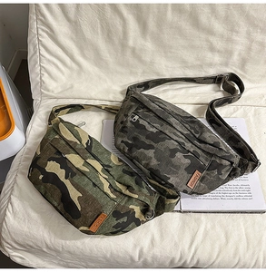 Overhead view of camouflage canvas chest bags with adjustable straps on magazine background