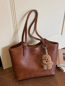 Vintage brown large capacity tote bag in PU leather with a cute plush dog pendant charm