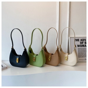 Group shot of four minimalist hobo underarm bags in black, green, tan, and cream white