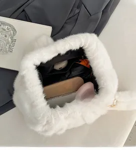 Interior view of white faux fur tote showing spacious main compartment and zipper pocket