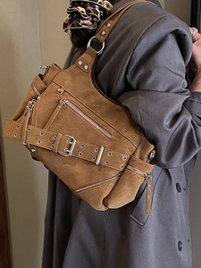Retro studded tote bag in dark brown suede with biker style metal hardware and rivets