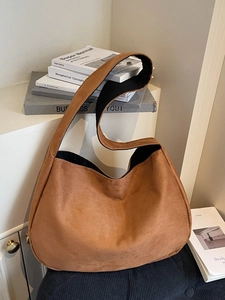 Brown frosted suede tote bag with wide shoulder strap in a minimalist urban style