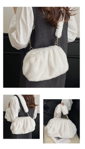 Detail of white faux fur cloud bag showing pleated texture and plush wide shoulder strap