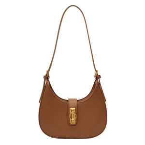 Brown leather crescent underarm bag with gold metal buckle and adjustable shoulder strap
