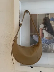 Minimalist caramel crescent shoulder bag in lychee pattern leather for women commute
