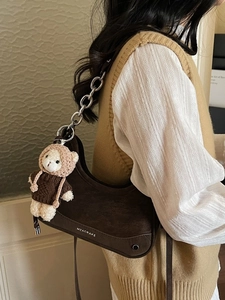 Vintage crescent hobo bag in dark brown with metal chain and teddy bear pendant