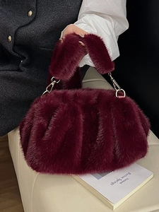 Chic burgundy faux fur dumpling handbag with soft pleats and gold metal link hardware