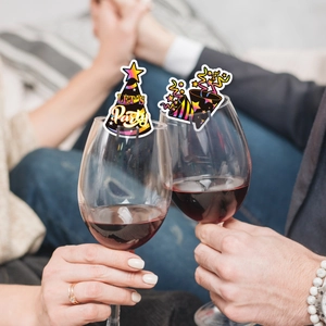 New Year party wine glass cards featuring colorful party hats and sparkling firework designs